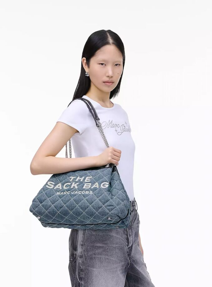 The Quilted
Denim Chain Sack Bag MARC JACOBS